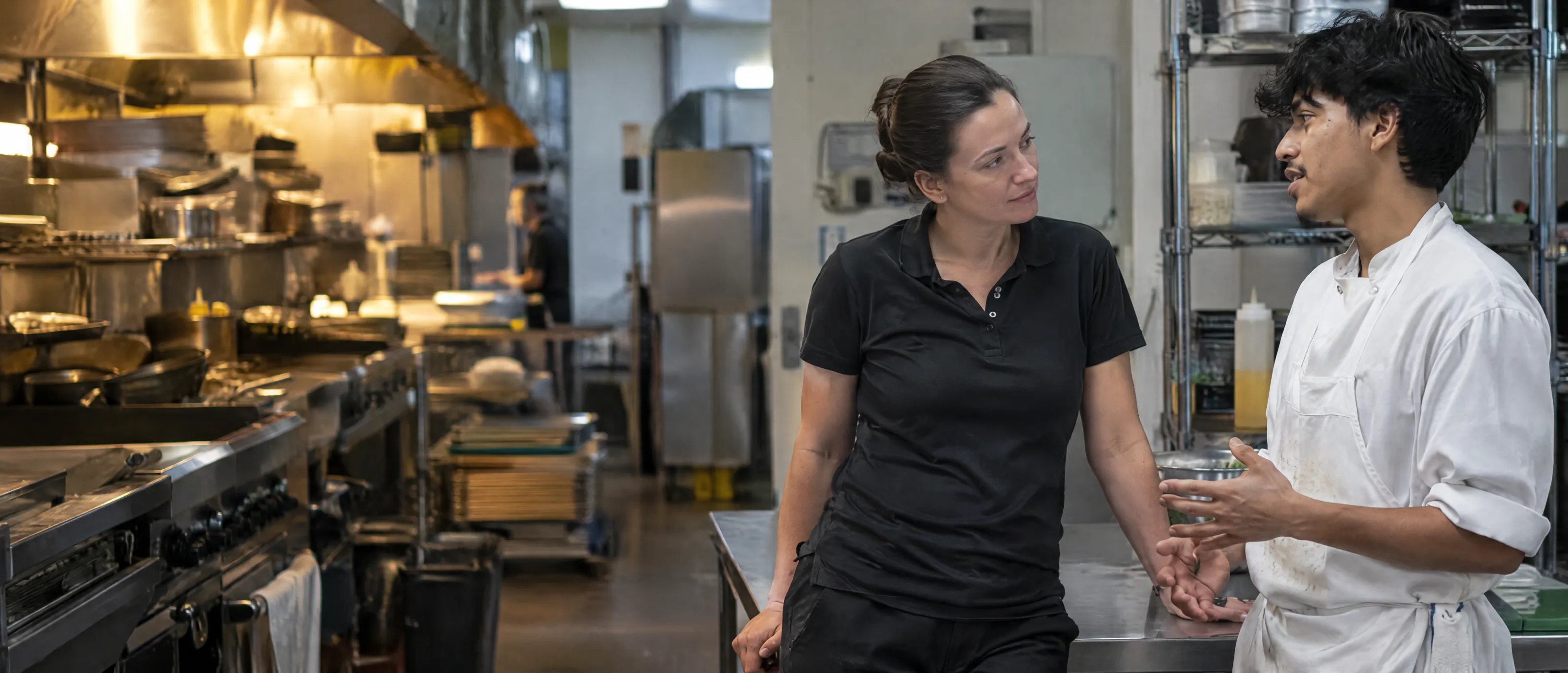 A manager talking one to one with a cook after the push